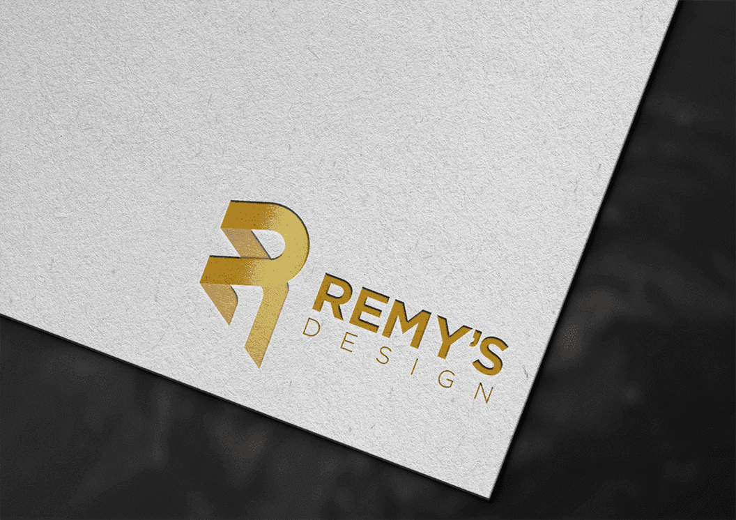 Remy's Design gold foil logotype on textured paper